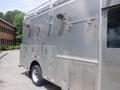 A silver 2007 Morgan Olson Workhorse W42 featuring a utility body with multiple compartments and mounted lights on the side