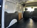 Interior view of a 2022 Ford Transit Connect with a spacious cargo area featuring a flat floor and side paneling