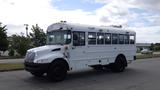 2015 International PC105 school bus with a white exterior and multiple windows on the side