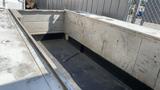 A 2000 Service Deck 9 Foot with a metallic surface and a textured floor showing signs of wear and tear