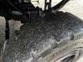 Close-up of a rugged tire from a 2007 Tennant Sentinel showcasing deep tread and textured surface designed for traction