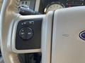 Close-up of the steering wheel controls in a 2013 Ford Expedition featuring buttons for on off set and resume functions