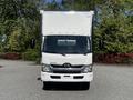 A white 2020 Hino 195 box truck facing forward with a large cargo area and a prominent front grille