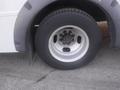 A close-up of the wheel and tire of a 2016 Chevrolet Express showing the rim and tread pattern