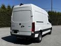 A 2022 Mercedes-Benz Sprinter van in white with a high roof and wide rear doors showcasing its spacious cargo area and sleek design