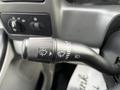 A close-up of the turn signal and headlight control stalk from a 2008 Ford F-750