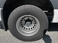 Close-up of a wheel from a 2022 Mercedes-Benz Sprinter showcasing a steel rim and a tire with tread pattern
