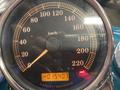 Speedometer display of a 2009 Harley-Davidson Flstc showing km/h values with a reading of 15407 km