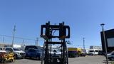 A 2018 Toyota 8FGCU25 forklift in the foreground with forks raised and ready for lifting