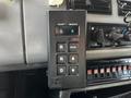 A control panel with buttons labeled R N D and additional settings mounted in the cabin of a 1994 Freightliner FL80 vehicle