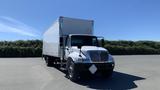 A 2019 International 4300 box truck in white with a large cargo area and a diamond-shaped sign on the front bumper