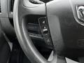 Close-up of the steering wheel of a 2018 RAM Promaster featuring various control buttons for volume and cruise settings