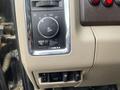 Control panel of a 2010 Dodge Ram featuring knobs and buttons for lights and additional functions