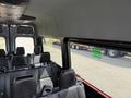 Interior view of a 2019 Mercedes-Benz Sprinter showing seats arranged for passenger transport with a clear view of the cabin space