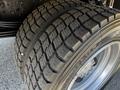 Close-up of a treaded tire on a 2020 Hino 195 showcasing detailed grooves and a metallic rim