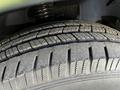 Close-up of a tire from a 2021 Mercedes-Benz Sprinter showing tread pattern and surface details