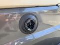 Close-up of the charging port for a 2019 Yamaha G29 E Electric Golf Car featuring a circular design with three prongs inside