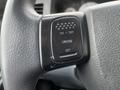 A close-up of a cruise control button on the steering wheel of a 2008 Dodge Ram 5500 featuring labeled settings for on off cruise and set