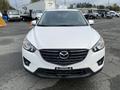 Front view of a white 2016 Mazda CX-5 with a black grille and sleek headlights