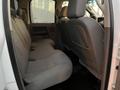 Interior of a 2008 Dodge Ram 5500 showing the rear seating area with two rows of gray fabric seats and a central armrest