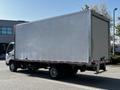 A 2020 Hino 195 box truck with a plain silver cargo area and a single rear axle positioned at an angle showing its side and back