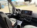 A 2019 Mercedes-Benz Sprinter interior featuring a steering wheel dashboard and center console with controls and a touchscreen display
