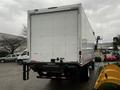 A white 2020 Hino 338 truck with a boxy cargo area visible from the back showing no markings or logos