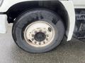 Close-up of a tire mounted on a 2008 Hino 268 showing the rim and wheel bolts with visible wear on the tire tread