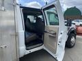 2010 Ford F-550 with an open passenger door displaying a spacious interior and two front seats