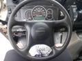 Close-up of the steering wheel and dashboard of a 2007 Morgan Olson Workhorse W42 showing gauges and controls