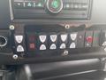 Dashboard control panel of a 2017 Chevrolet Express featuring multiple buttons for lights and other functions