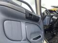 Close-up of the interior door panel of a 2008 Hino Conventional Cab showing the handle and armrest