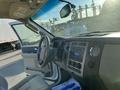 Interior of a 2013 Ford Expedition showcasing the dashboard steering wheel and control dials