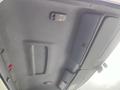 Interior view of the ceiling in a 2008 Hino 268 with light fixtures and storage compartments visible