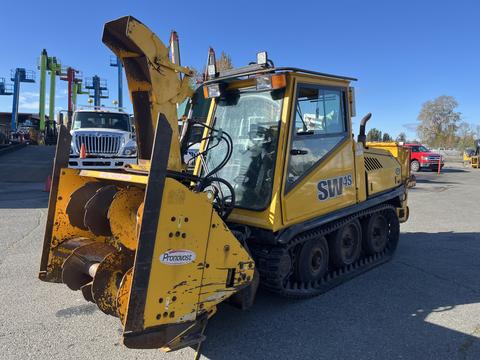 A yellow 2008 Camoplast SW 4S snow blower vehicle with tracks and a large front auger attachment