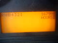 Display screen of a 2008 International 7400 showing an orange background with the numbers 4321 and 16799 HOURS