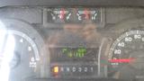 Dashboard of a 2011 Ford Econoline showing fuel gauges odometer and trip information