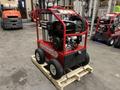 A red 2024 Magnum 4000 Hot Water Pressure Washer with a black engine mounted on a sturdy frame and large wheels for mobility