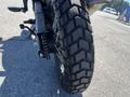 Close-up of the rear tire of a 2022 Royal Enfield Himalayan showcasing its rugged tread pattern and sturdy build