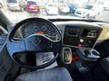 Interior view of a 2013 International DuraStar 4300 featuring a steering wheel dashboard with gauges and controls including a radio and gear shift area