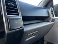 A close-up view of the interior dashboard of a 2017 Ford F-150 showing the air vents and a 12V power outlet