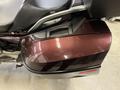 2013 BMW K1600GTL motorcycle with a shiny maroon side pannier and sleek design elements