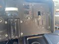 Dashboard controls of a 2007 Freightliner MT55 featuring gear shifter with positions P R N D 3 2 1 various knobs and switches