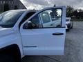 A 2017 GMC Sierra 1500 with the driver's door open displaying the Sierra logo on the side of the vehicle