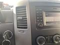 Interior dashboard of a 2017 Mercedes-Benz Sprinter featuring air vents audio control panel and knobs for temperature and radio settings