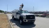 A 2011 Ford F-450 Super Duty truck with a utility body and an articulated crane mounted on top