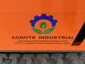 Logo of Agrotk Industrial featuring a gear and leaf design with the company name and email address displayed underneath