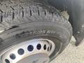 A close-up view of a tire on a 2017 Mercedes-Benz Sprinter displaying tread patterns and markings on the sidewall