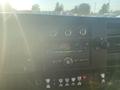 Dashboard of a 2017 Chevrolet Express featuring audio controls climate knobs and various buttons