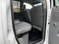 Interior view of a 2008 Dodge Ram 5500 showing the rear seating area with grey upholstery and black floor mats